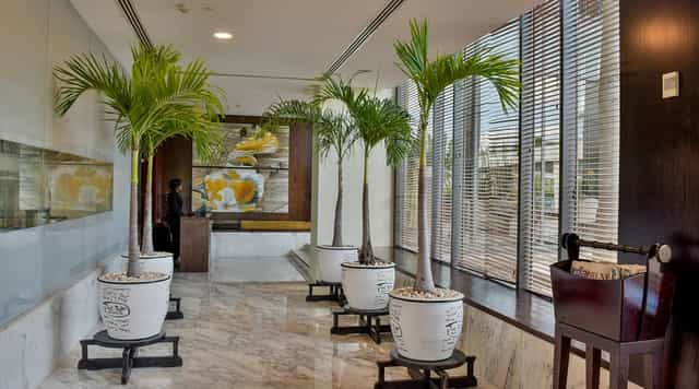 Modern corporate pre-function area with sleek finishes for hotel conference registration events.