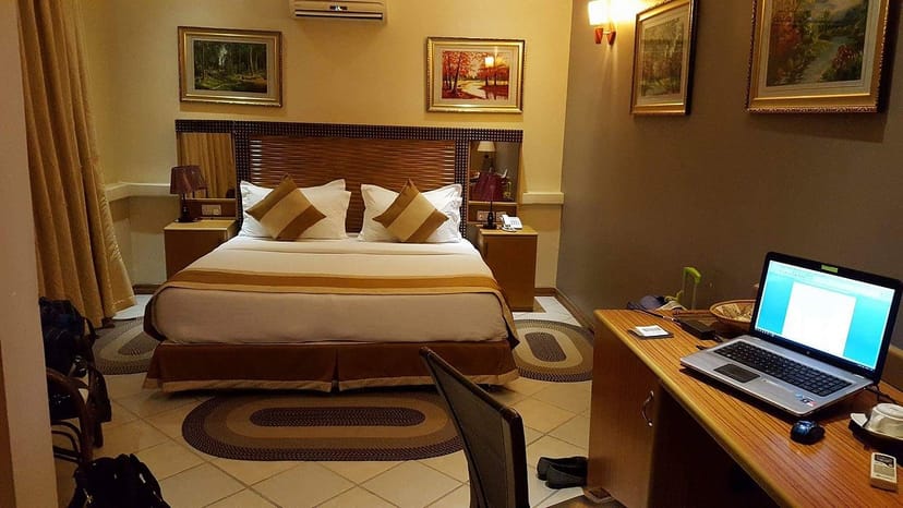 Amariah Hotel Mikocheni business room with desk workspace for corporate meetings and events.