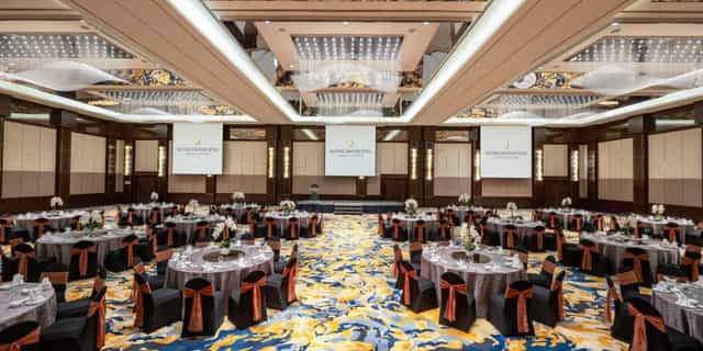 Kuala Lumpur pillarless ballroom with copper accents for gala and awards banquet events.