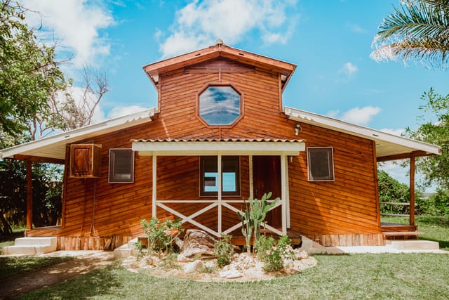 Rustic beach cabins at The Overhang, ideal for intimate executive retreats and wellness workshops.