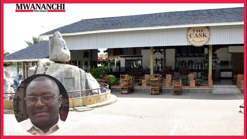 Open-air bar and grill with central sculpture for corporate mixers and social events.