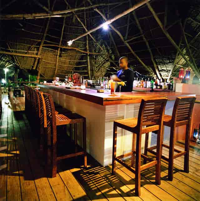 Rustic Fundu Lagoon restaurant with warm lighting for corporate events and incentive receptions.