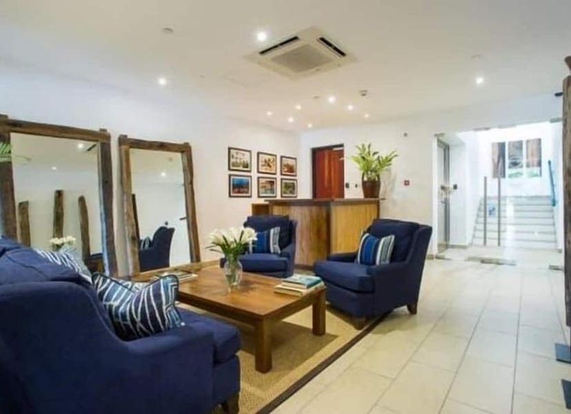 Boutique hotel breakout suite with mirrored walls for VIP consultations and event registration.