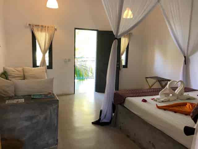 Minimalist boutique hotel suite with terrace for executive retreats and luxury incentive travel.