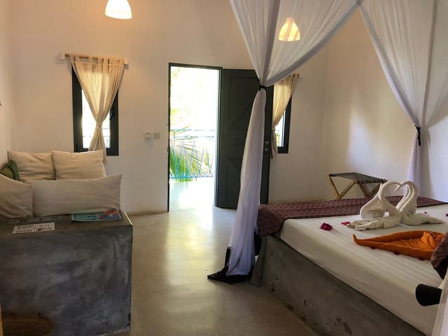 Minimalist boutique hotel suite with terrace for executive retreats and luxury incentive travel.