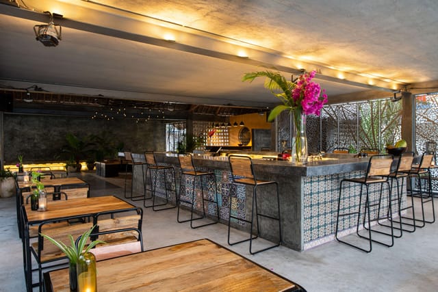 Semi-open-air Casa Beach Hotel suite with industrial decor for networking mixers and receptions.