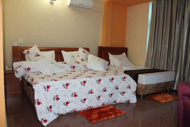 Twin-share budget hotel room in Kariakoo for group bookings and event accommodation.