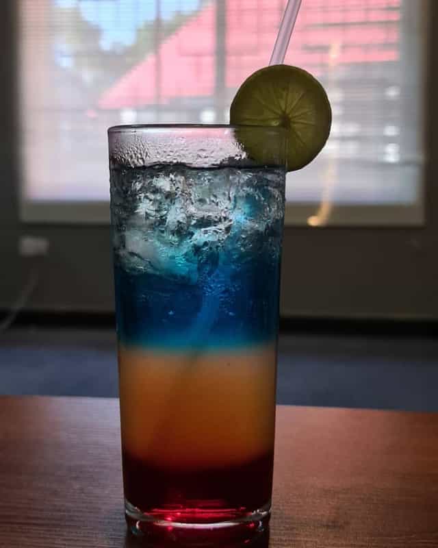 Branded cocktail at a corporate gala event, signature drink for evening reception.