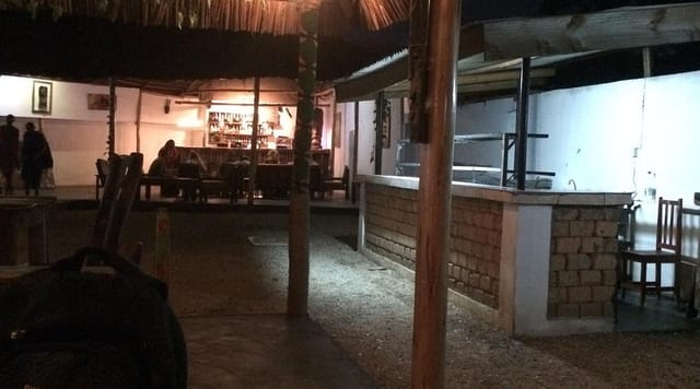 Rustic Makuti Banda at Brigitte's Inn with gravel floor for casual team-building events.