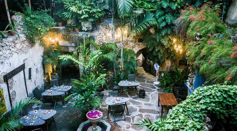 Rustic Secret Garden restaurant courtyard for intimate cocktail reception and boutique dinner events.