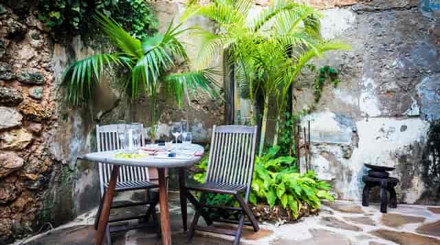 Rustic VIP dining nook in Secret Garden Restaurant for private events and intimate dinners.