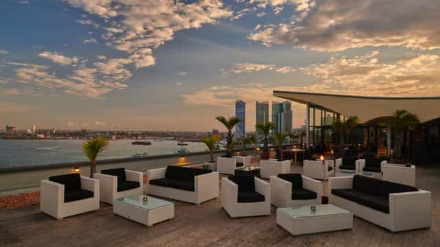 Rooftop lounge at Flame Tree with sunset views for upscale welcome receptions and networking events.