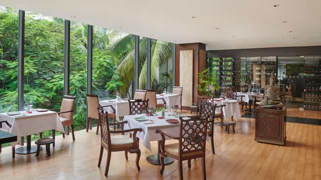 Flame Tree Lounge with floor-to-ceiling windows for corporate luncheons and VIP events.