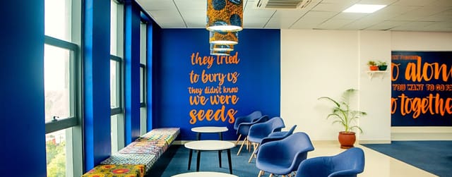 Private office breakout space with accent wall for corporate events and team meetings.
