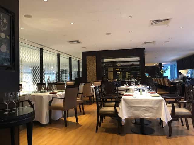 Upscale restaurant venue for corporate dinners and VIP networking events with elegant table settings.