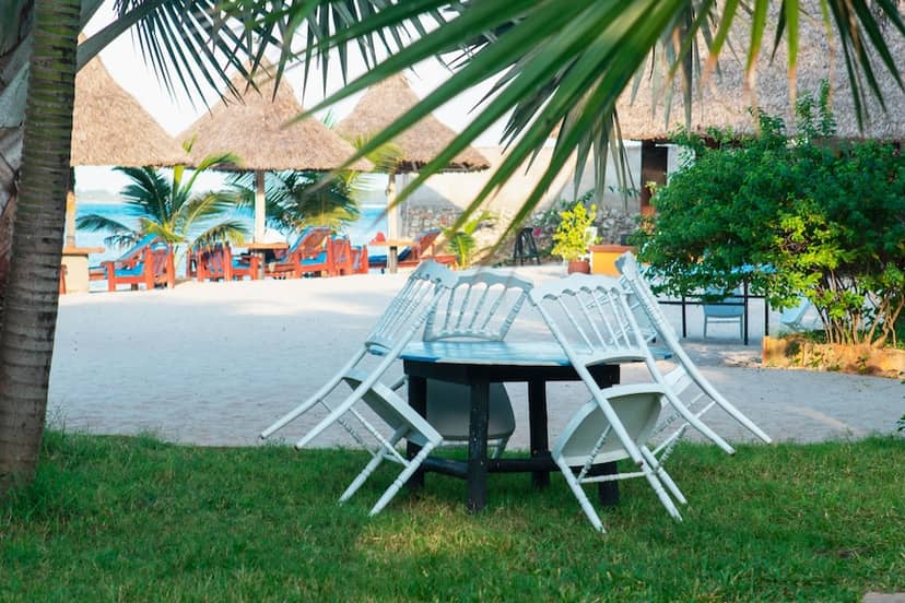 Beachside event teardown at Kijiji Beach Resort, clearing furniture for outdoor venue reset.