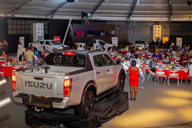 Automotive product launch in a gala banquet setup at The Super Dome Tanzania with vehicle display.