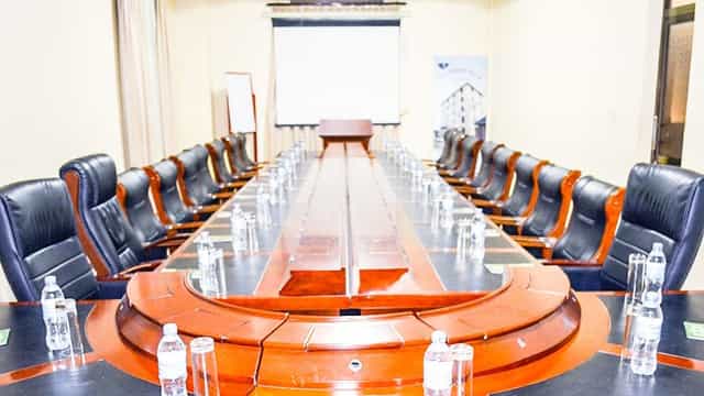 Boardroom at Lifelights Hotel Academica with executive chairs for formal corporate meetings.