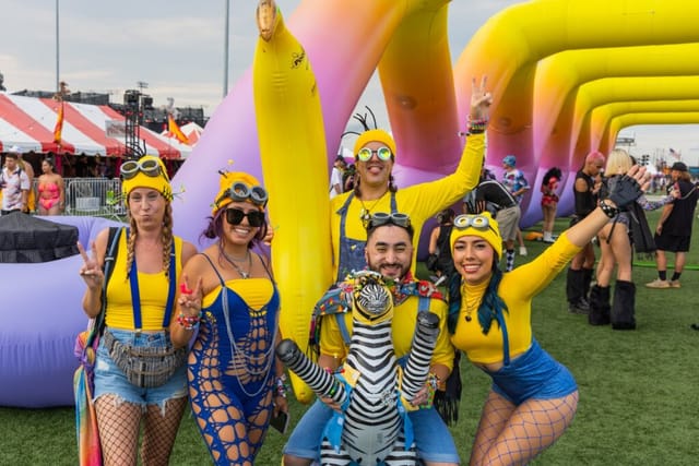 North Coast Music Festival sports activation with colorful inflatables and costumes.