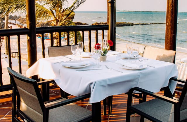 Executive dinner setup at Kisiwa Bar, Hotel White Sands with waterfront views for VIP events.