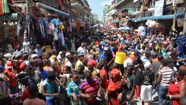 Crowded Kariakoo Market aisles with blocked exits, illustrating event venue safety risks.