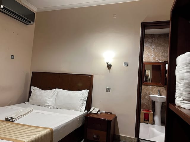 K27 Premier Inn hotel room, functional budget design, ideal for business travel and event lodging.