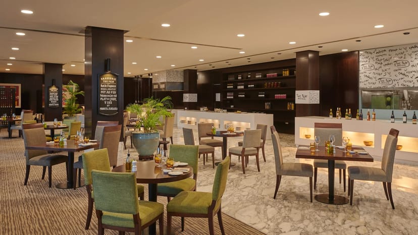 Luxury hotel breakout space with upholstered seating for corporate networking events.