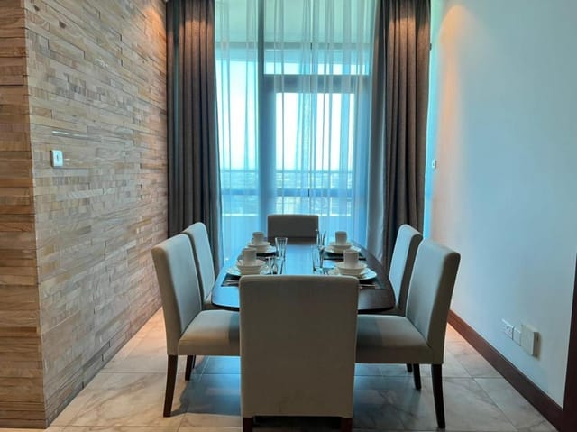 Executive boardroom at Fairview Luxury Apartments with natural light for corporate meetings.