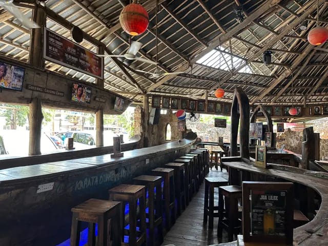Rustic open-air lounge for networking reception and cocktail hour.