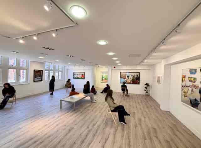 Minimalist MODO Gallery space with scatter seating for art exhibitions and creative events.