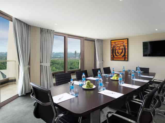 Boardroom at Hotel Ideal Dar es Salaam with natural light for executive meetings and conferences.