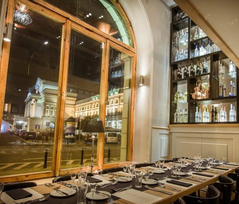 Elixir Restaurant: Sophisticated illuminated bar for corporate dinners and VIP reception events.