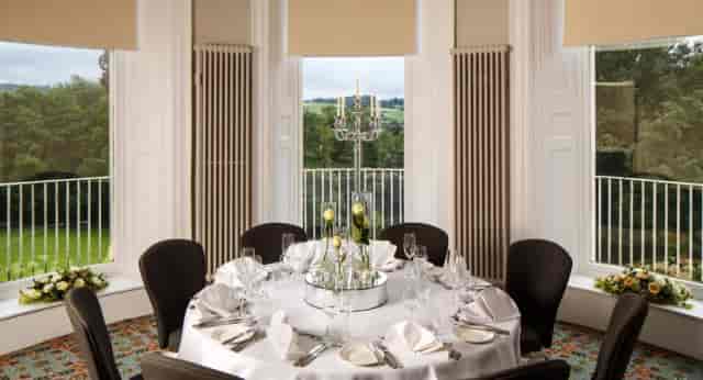 Congress Room at Bowden Hall Hotel: Elegant round table setup for intimate events and conferences.