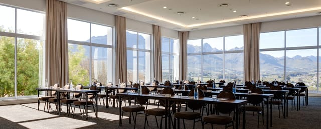 Magnifica Suite meeting space with mountain views for corporate workshops and executive conferences.