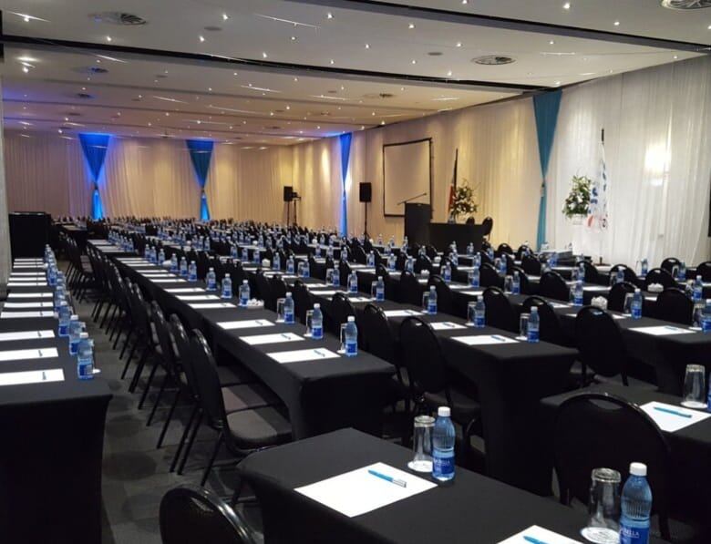 Atlantic Suite classroom setup with elegant up-lighting for corporate events and conferences.