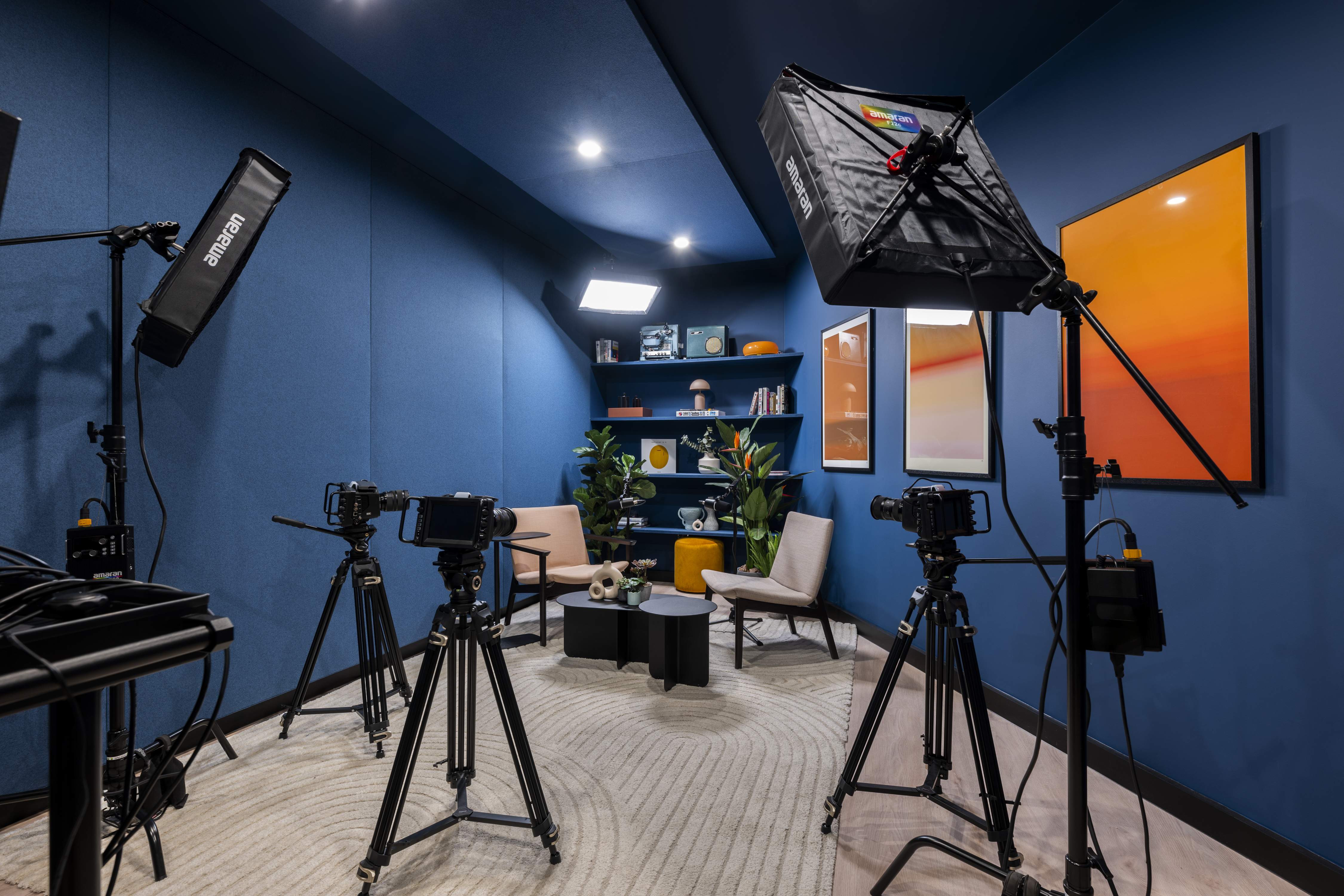 Video conferencing setup in Qube Elephant Lounge for hybrid meetings and events. - Banner