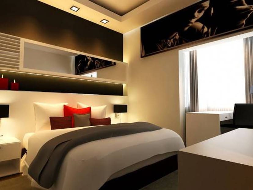 Modern hotel room with ergonomic workspace for corporate business travel and luxury room blocks.