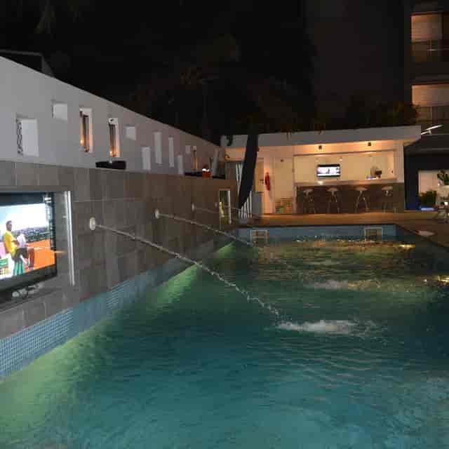 Poolside venue at Maison Fahrenheit with lounge seating for networking and VIP events.