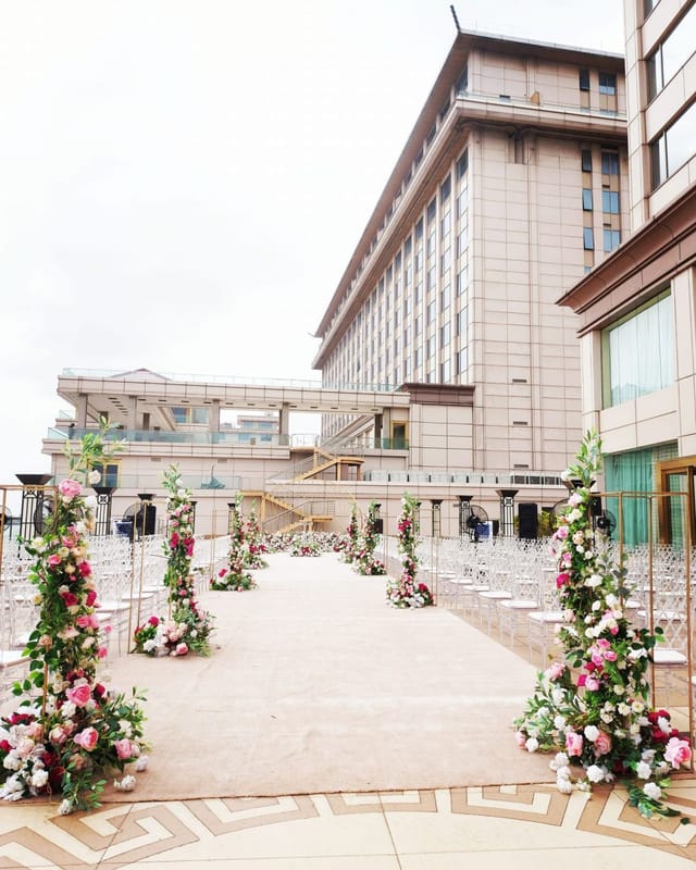 Outdoor wedding ceremony setup with floral aisles at Lagos Oriental Hotel event venue.