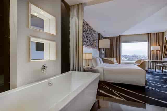 Luxury hotel suite in Radisson Lagos Ikeja with executive desk for VIP business travel and events.