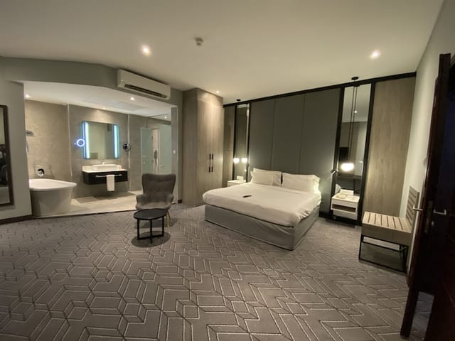 Luxury hotel suite at Radisson Lagos Ikeja for VIP speaker accommodation and corporate travel.