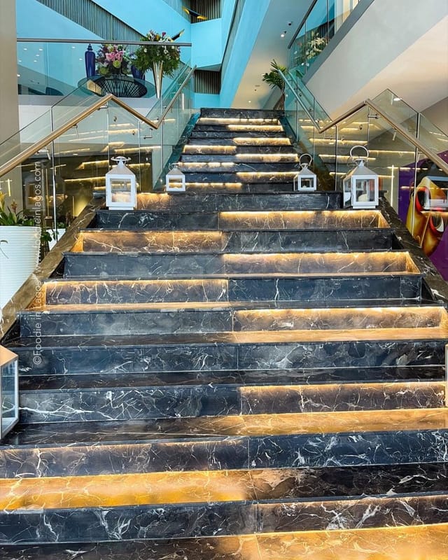 Grand staircase at Mist Restaurant, The Art Hotel: elegant venue for luxury event and reception.