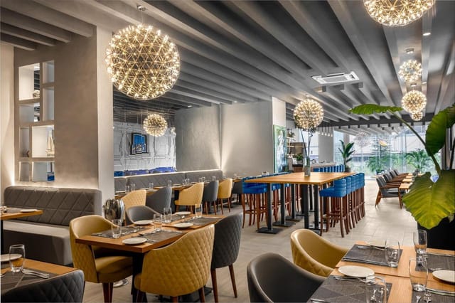 Contemporary rooftop event space with modern dining setups for corporate mixers and networking.