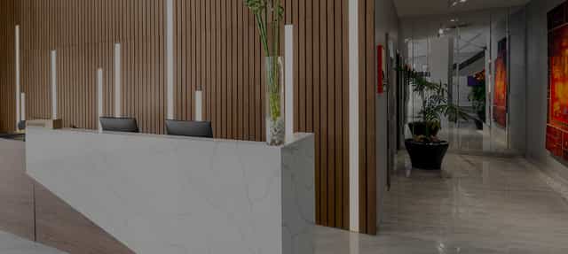Modern hotel banquet reception area for professional event check-in.