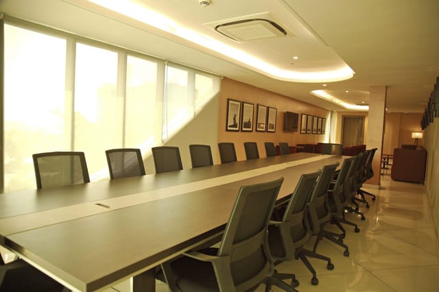 Boardroom setup at EbonyLife Place: executive meeting space with natural light for conferences.