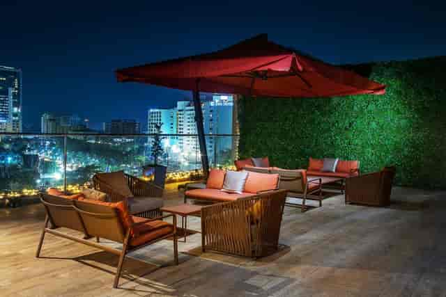 Rooftop lounge at EbonyLife Place with urban skyline, ideal for networking events and VIP sessions.