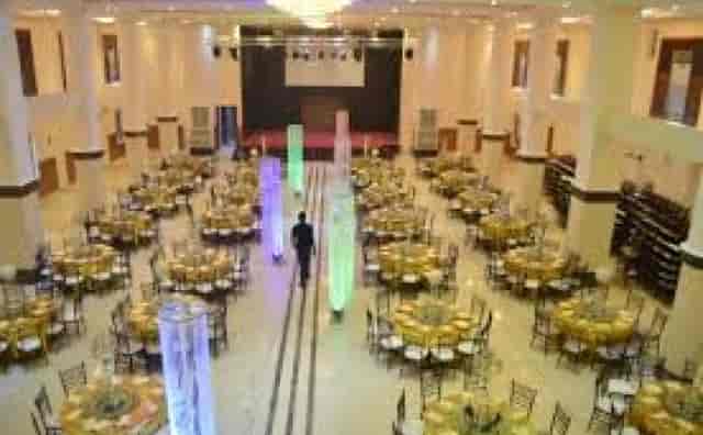Lekki Coliseum ballroom with illuminated pillars for gala dinner or corporate event.