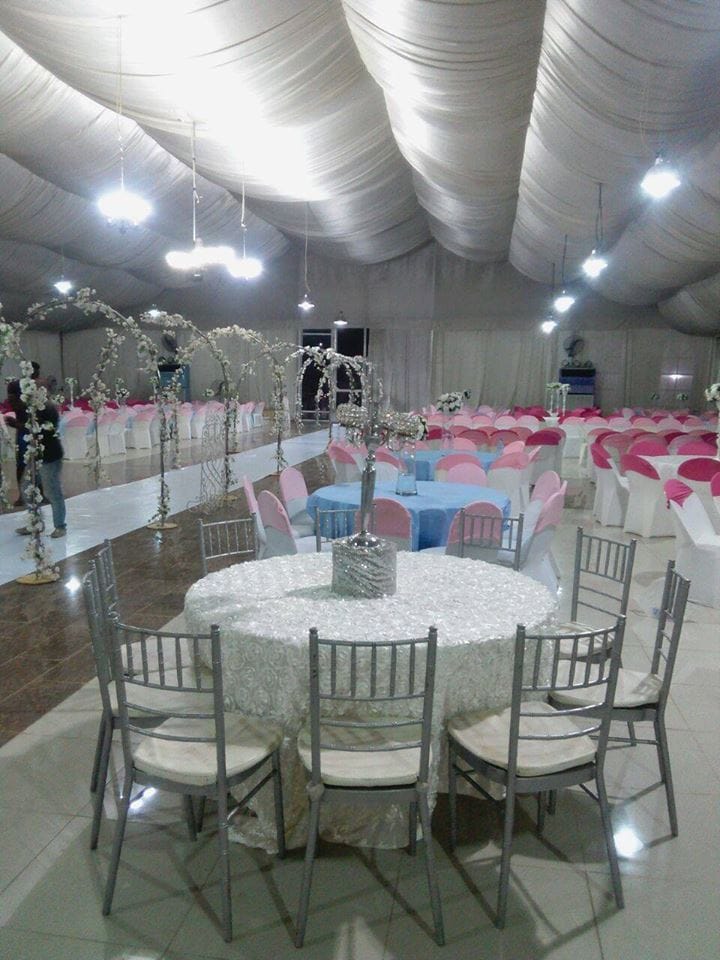 Apex marquee wedding reception setup with crystal candelabra at Iconic Castle Event Center.