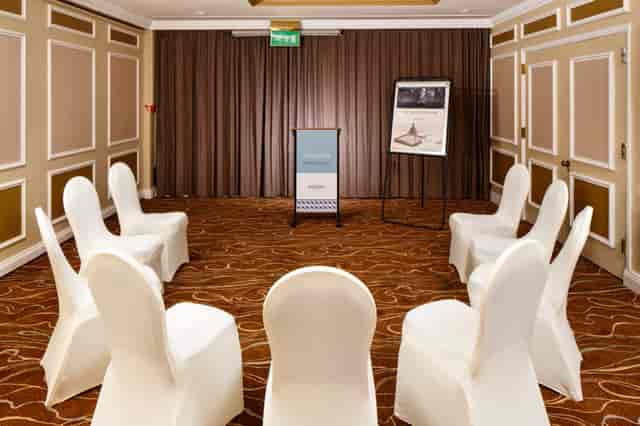 Classroom-style meeting room at Mercure Livingston with lectern for professional business events.