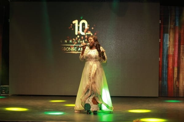 10th anniversary stage with LED branding and professional presenter for keynote event.